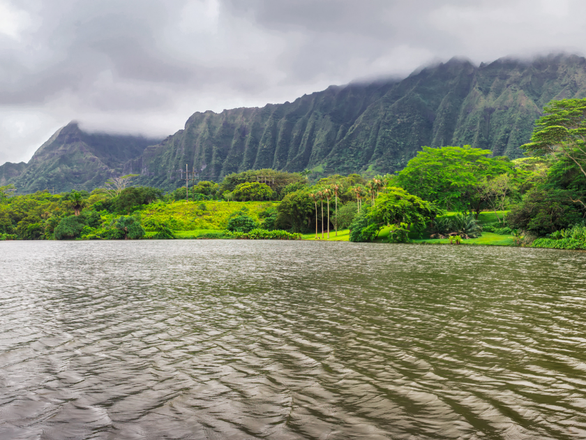 Panoramic view of lake and mountains in Hoomaluhia botanical garden, Oahu island, Hawaii