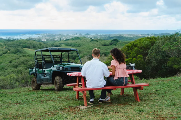 Gunstock Ranch ATV with couple sitting on bench