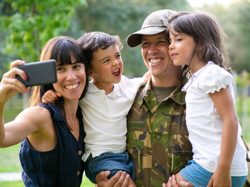 Happy joyful military family celebrating dads returning