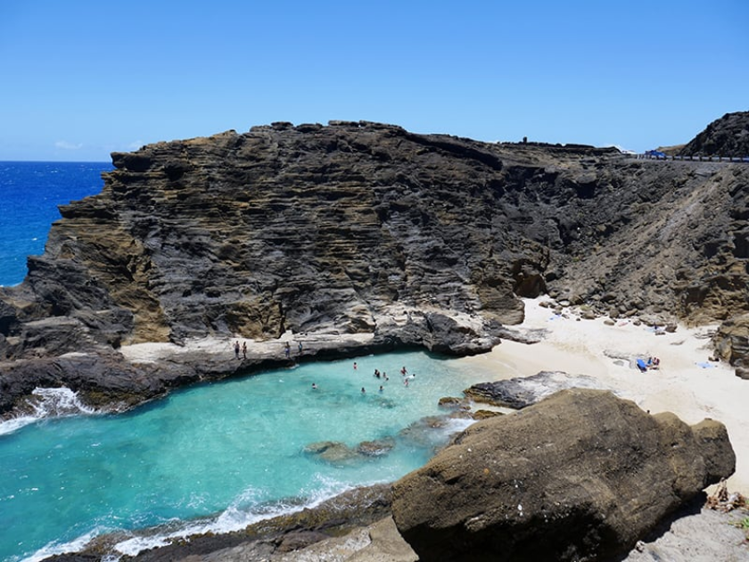 Halona Blowhole acts like an ocean-driver geyser as the ocean breezes push waves into the cave below and a hole in the rock formation shoots sea spray jets high into the air.