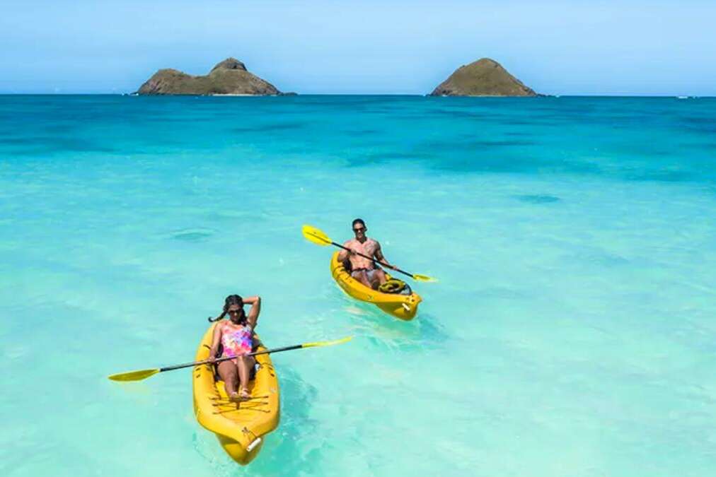 Man and Woman Kayaking with Na Mokulua in the background