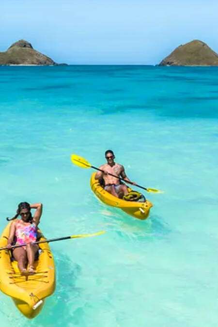 Man and Woman Kayaking with Na Mokulua in the background