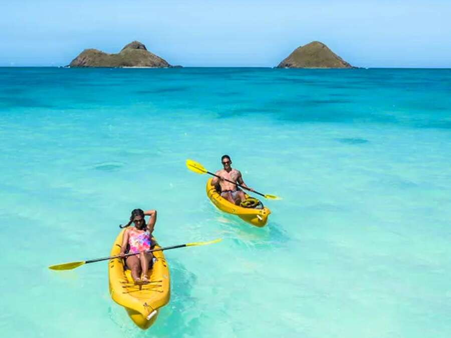 Man and Woman Kayaking with Na Mokulua in the background