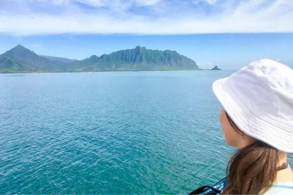 Passenger enjoying the view of Kaneohe Bay by Captain Bob's