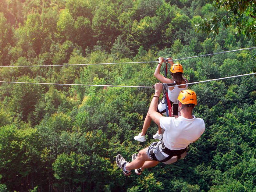 Couple ziplining