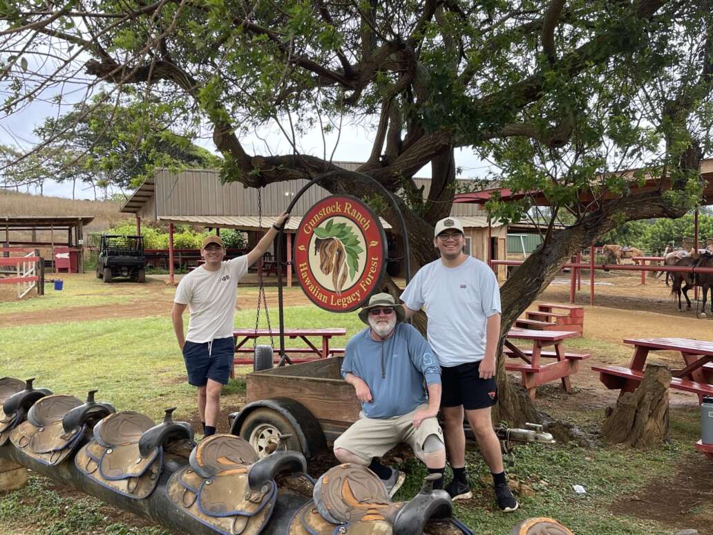 Men visitors enjoying the peaceful shaded area on top of the ranch