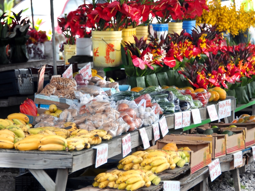 Hilo's Farmer's Market is filled with fruits and vegetables and buckets and bouquets of fresh cut tropical flowers.