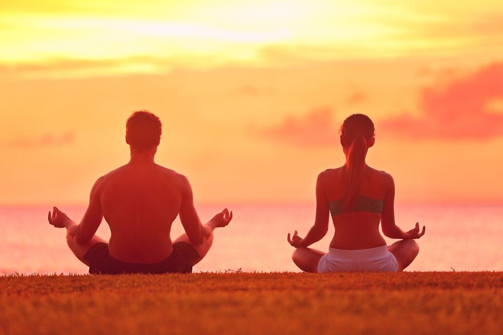 Meditation,Yoga,Couple,Meditating,At,Serene,Beach,Sunset.,Girl,And