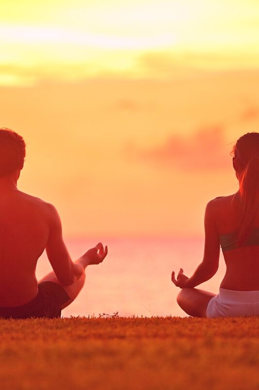 Meditation,Yoga,Couple,Meditating,At,Serene,Beach,Sunset.,Girl,And