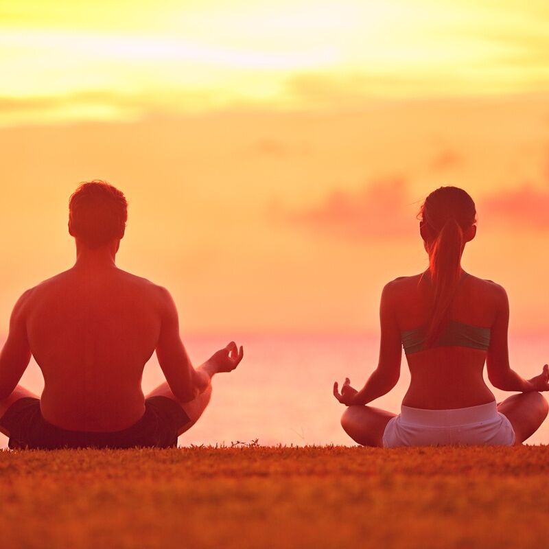Meditation,Yoga,Couple,Meditating,At,Serene,Beach,Sunset.,Girl,And