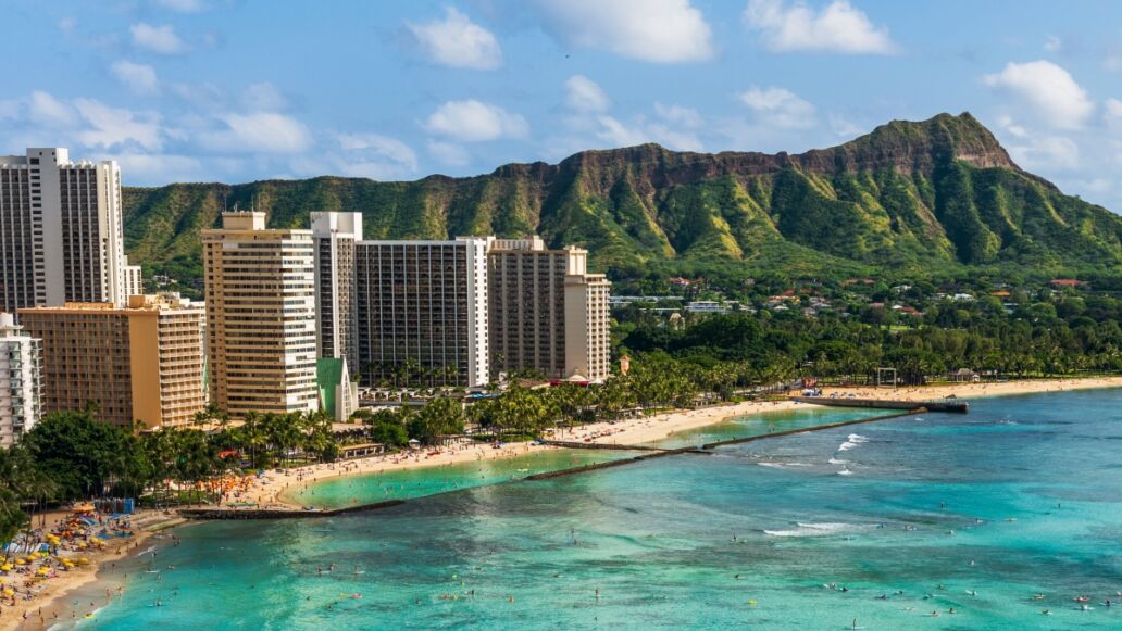 Hawaii panoramic Honolulu city travel landscape banner background of Waikiki beach and Diamond Head mountain peak at sunset, Oahu island, USA vacation.