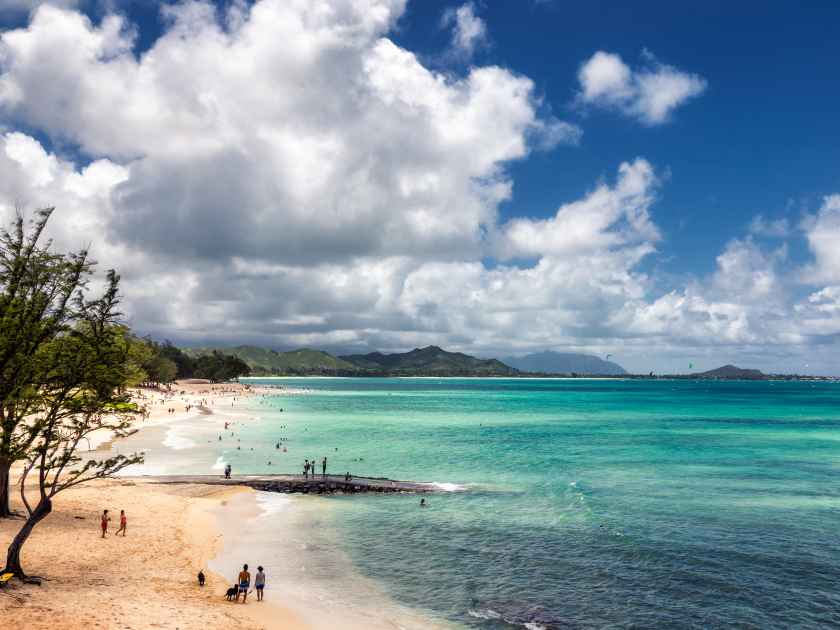 View of Kailua beach with lots of people sunbathing and swimming