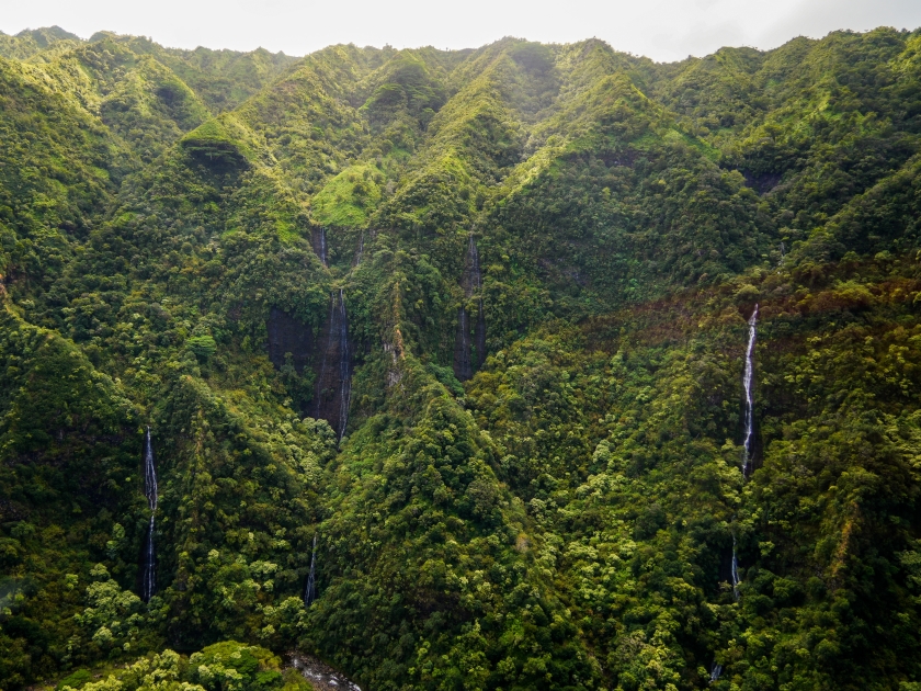 Aerial view of Hanapepe Valley on Kauai island, Hawaii, United States - Multiple waterfalls in a lush tropical landscape