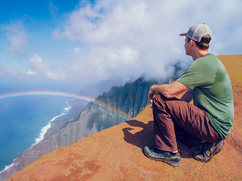 Man,Looking,At,Na,Pali,Coast,Sea,Cliffs,In,State