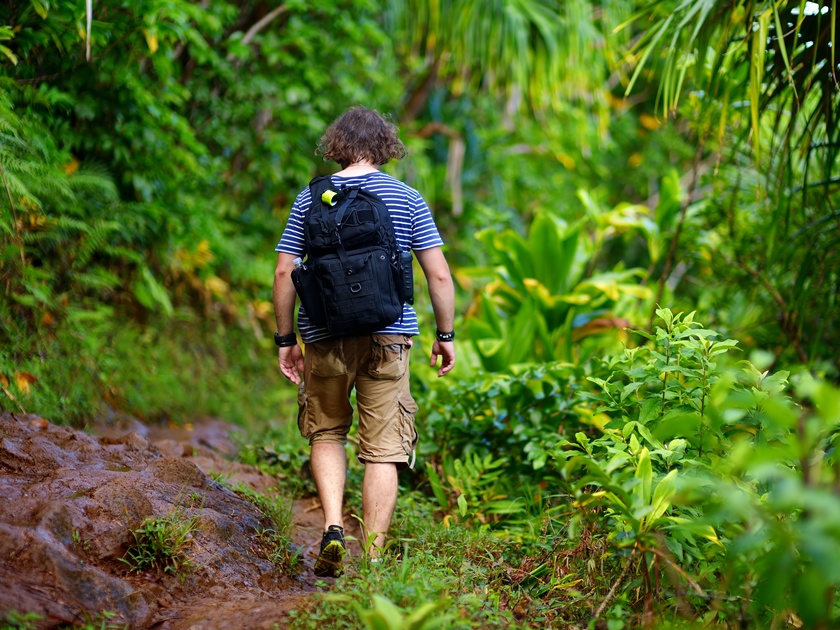 Young,Male,Tourist,Hiking,On,The,Famous,Kalalau,Trail,Along
