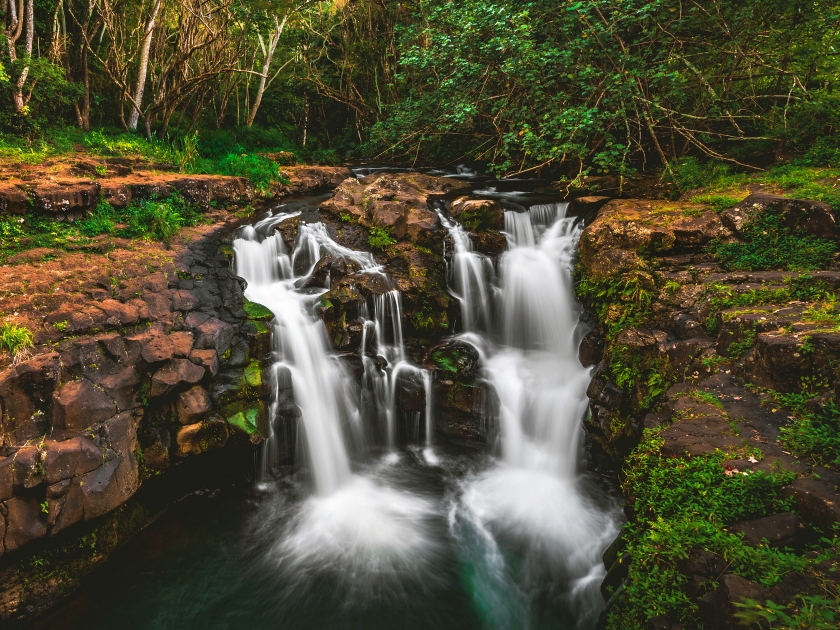 Ho'opi'i Falls, a set of waterfalls and popular hiking location and local swimming hole along Kapaʻa Stream, located near Kapaʻa town on the east shore of the island of Kauai, Hawaii, United States.