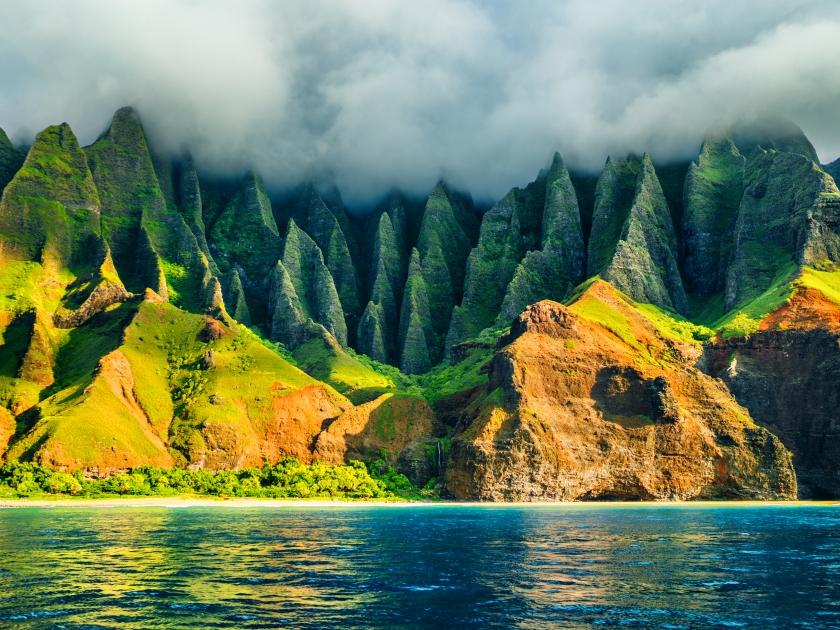 Na Pali coast, Kauai, Hawaii view from sea sunset cruise tour. Nature coastline landscape in Kauai island, Hawaii, USA. Hawaii travel.