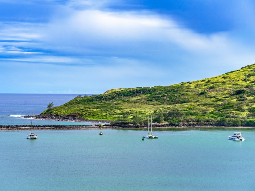 View,Of,Shoreline,With,A,Lush,Green,Hill,,Ocean,,And