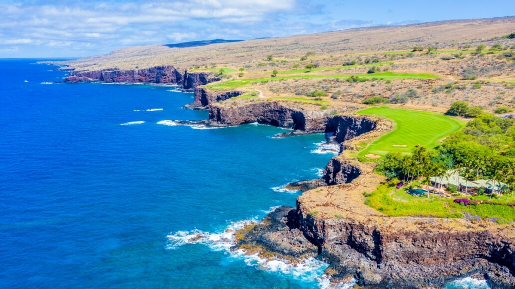 Aerial view of Lanai, Hawaii looking west at the rocky cliffside bordering the Pacific Ocean