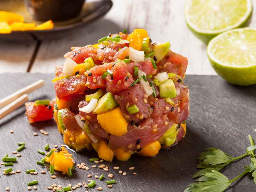 Hawaiian tuna poke with mango, avocado, onion and sesame seeds.