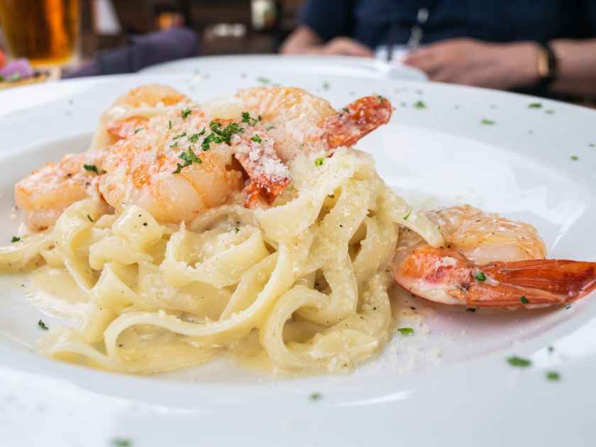 Italian pasta fettuccine in a creamy sauce with shrimp in Kailua-Kona on Hawaii Island.