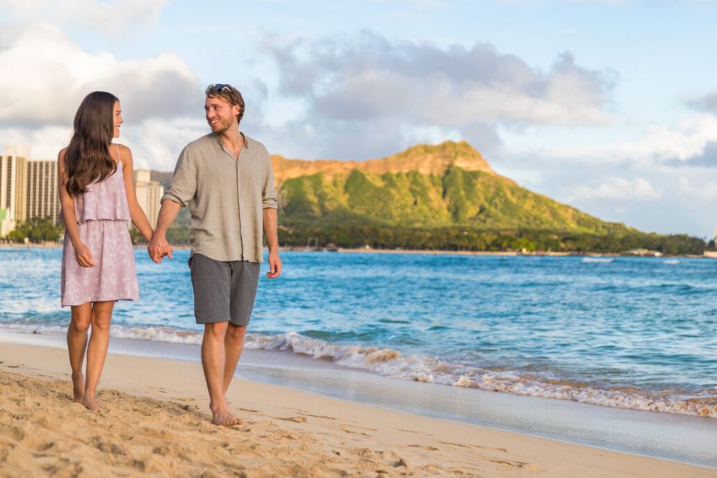 Couple,Walking,On,Waikiki,Beach,Hawaii,Vacation.,Happy,Couple,In