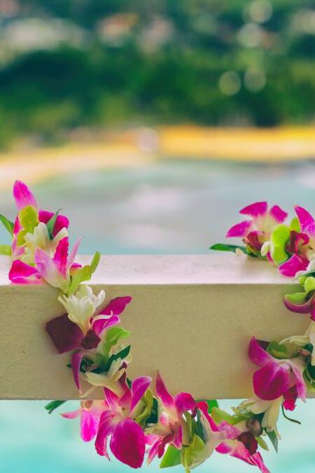 Hawaii background hawaiian flower lei with Waikiki beach landscape.