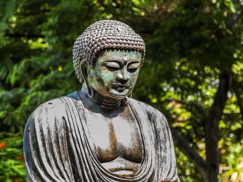 A replica of Daibutsu, The Great Buddha of Kamakura, at Foster Botanical Gardens on Oahu, Hawaii