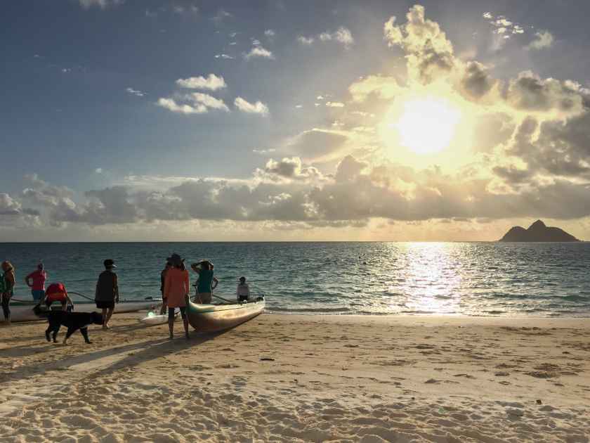 A group of people preparing for canoeing in Lanikai Beach, Kailua, United States