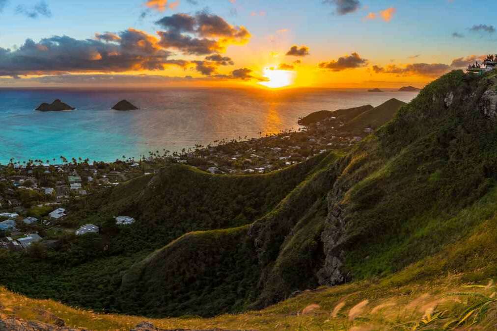 tropical sunrise over Lanikai Beach, Hawaii - from the Kaiwa ridge trail ( pillbox hike ) - see the mokulea islands, rabbit island, and makapuu