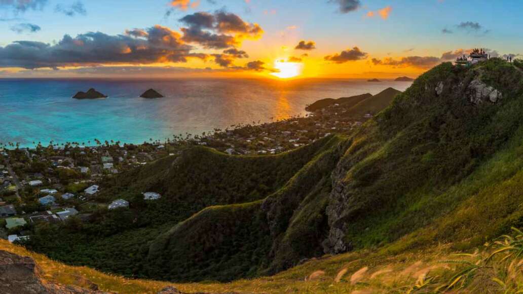 tropical sunrise over Lanikai Beach, Hawaii - from the Kaiwa ridge trail ( pillbox hike ) - see the mokulea islands, rabbit island, and makapuu