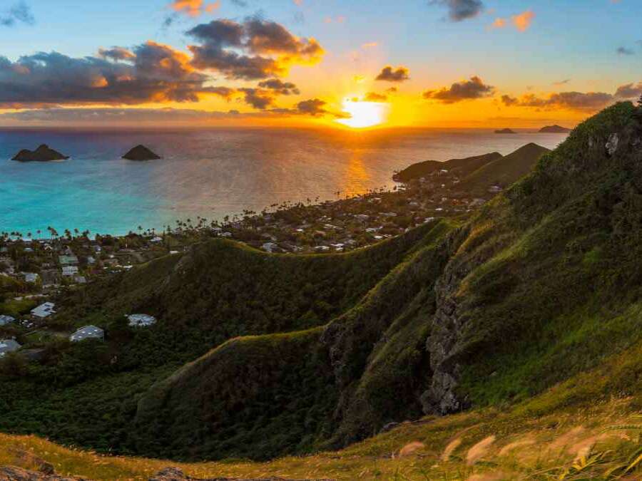 tropical sunrise over Lanikai Beach, Hawaii - from the Kaiwa ridge trail ( pillbox hike ) - see the mokulea islands, rabbit island, and makapuu