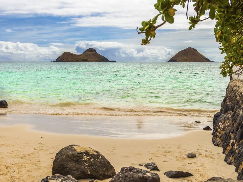 A view of Na Mokulua Islands, also known as The Mokes and Twin Islands, from the beach in Lanikai on Oahu, Hawaii