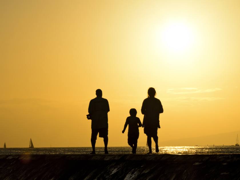 Family on Rocky Pier at sunset