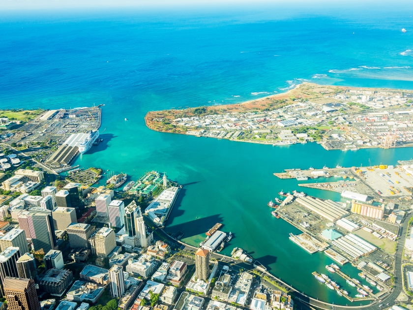 Aerial view of the Honolulu city from a jet plane right next to the Pearl Harbour