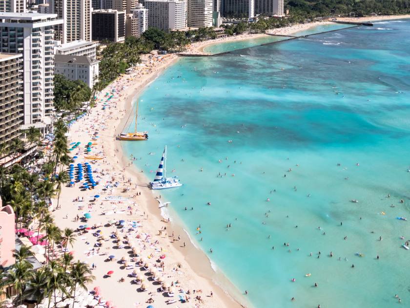 Waikiki Beach and Diamond Head Crater including the hotels and buildings in Waikiki, Honolulu, Oahu island, Hawaii. Waikiki Beach in the center of Honolulu has the largest number of visitors in Hawaii