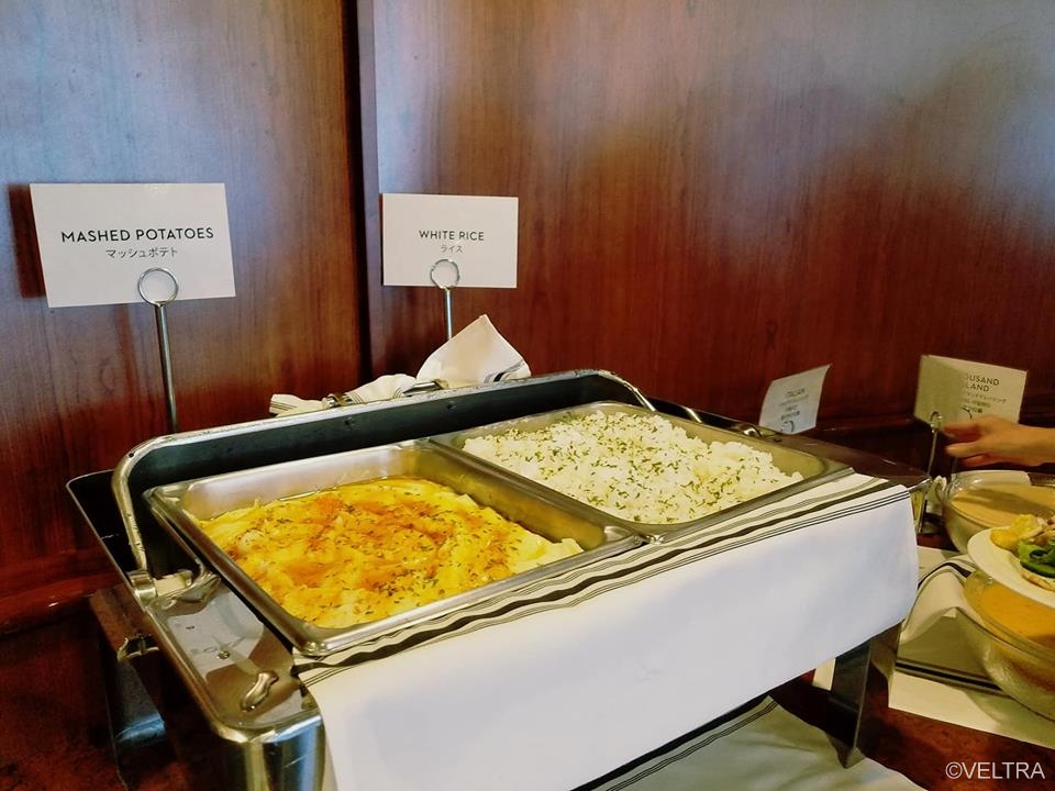 Side dishes include creamy mashed potatoes and white rice