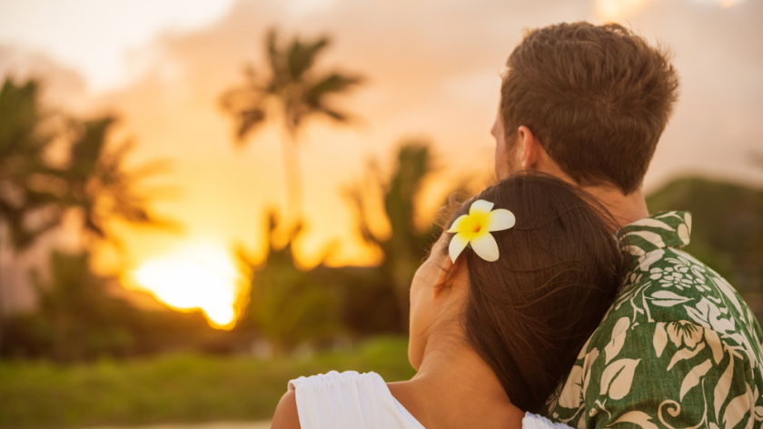 Couple in Hawaii watching sunset