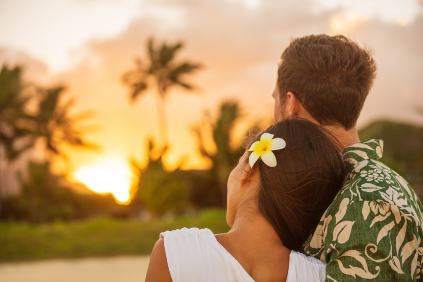 Couple in Hawaii watching sunset