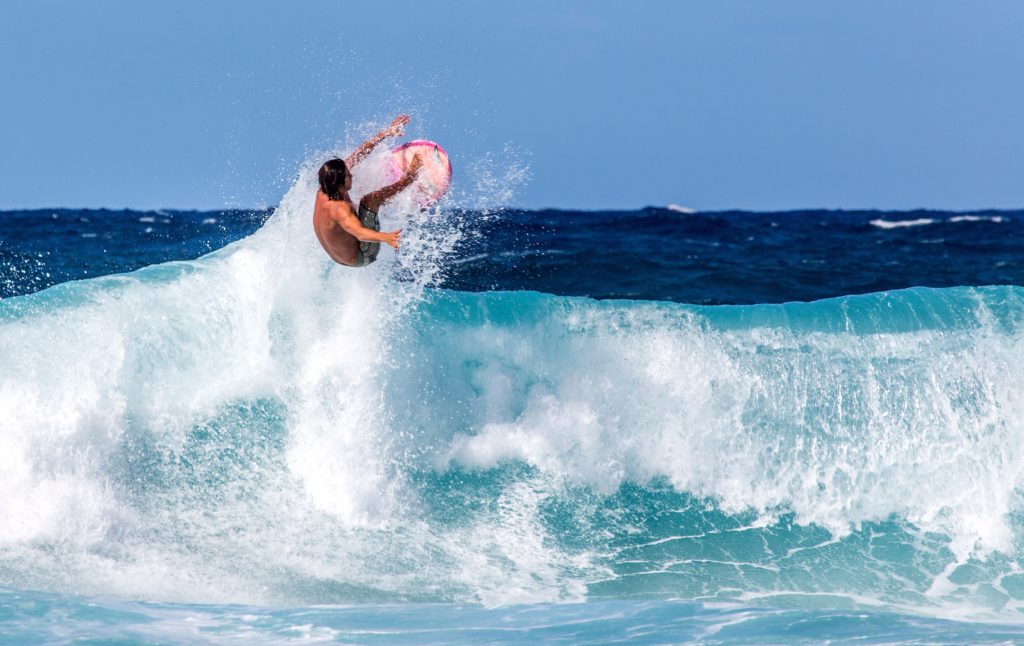 Towering North Shore waves attract surfers from around the world