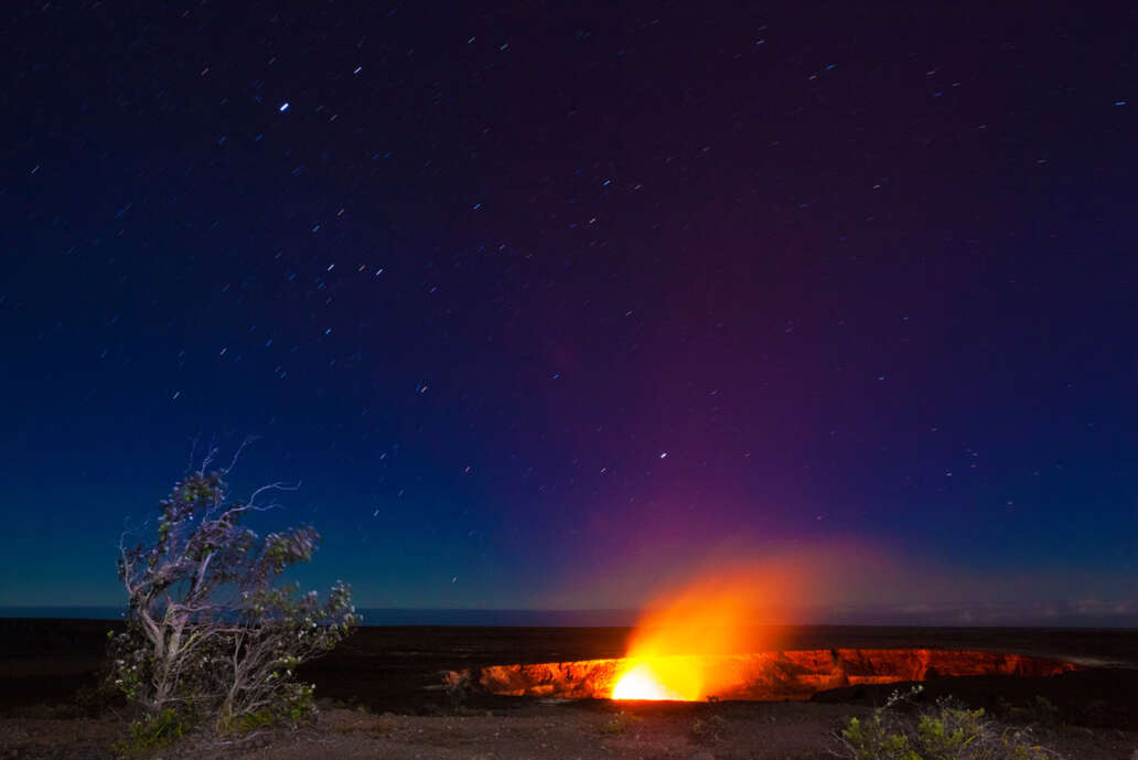 FThe lava of Kilauea Crater illuminates the night at Volcanoes National Park.