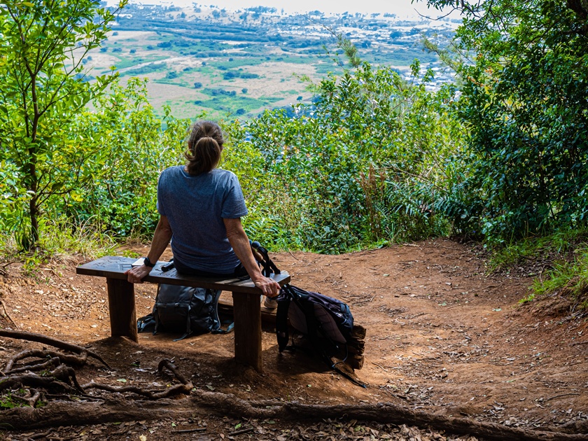 Female,Hiker,Relaxing,On,Bench,At,Overlook,On,The,Sleeping
